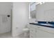Clean bathroom with blue vanity, toilet and shower at 456 Diamond Dr, Spring Hill, FL 34609