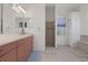 Bathroom boasts double sinks, shower, and a relaxing soaking tub at 456 Diamond Dr, Spring Hill, FL 34609