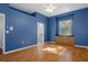Bright bedroom with wood flooring, window seat, and access to bathroom at 456 Diamond Dr, Spring Hill, FL 34609