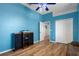 Bedroom with wood flooring and access to another room at 456 Diamond Dr, Spring Hill, FL 34609