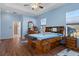 Spacious Primary bedroom with wood flooring and large walk-in closet at 456 Diamond Dr, Spring Hill, FL 34609