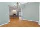 Dining room with light walls, wood flooring, and views to the living room at 456 Diamond Dr, Spring Hill, FL 34609