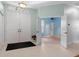 Bright and airy entryway with tile flooring and access to other rooms at 456 Diamond Dr, Spring Hill, FL 34609