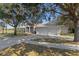 Spacious home with a three-car garage and a long driveway at 456 Diamond Dr, Spring Hill, FL 34609