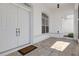 Inviting front entrance with double doors and a tiled porch at 456 Diamond Dr, Spring Hill, FL 34609