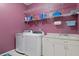 Laundry room with washer, dryer, and ample storage at 456 Diamond Dr, Spring Hill, FL 34609