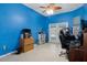 Home office with blue walls, wood flooring, and pool access at 456 Diamond Dr, Spring Hill, FL 34609