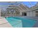 Inviting screened pool with a spa and spacious deck at 456 Diamond Dr, Spring Hill, FL 34609