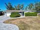 Single-story home with gray exterior and landscaping at 4629 Spahn St, Sarasota, FL 34232