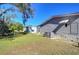 Mobile home backyard with a view of neighboring homes and trees at 4853 Blanco Dr, Zephyrhills, FL 33541