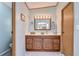 Bathroom with wood vanity and a large mirror at 4853 Blanco Dr, Zephyrhills, FL 33541