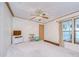 Spacious bedroom with ceiling fan, TV stand, and exercise area at 4853 Blanco Dr, Zephyrhills, FL 33541