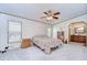 Main bedroom with ensuite access and ceiling fan at 4853 Blanco Dr, Zephyrhills, FL 33541