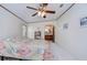 Spacious bedroom with ceiling fan and mirrored closet doors at 4853 Blanco Dr, Zephyrhills, FL 33541