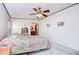 Main bedroom with ensuite access and ceiling fan at 4853 Blanco Dr, Zephyrhills, FL 33541
