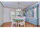 Bright dining room with built-in hutch and round table set at 4853 Blanco Dr, Zephyrhills, FL 33541