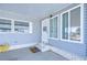 Mobile home entrance with covered porch and steps leading to the front door at 4853 Blanco Dr, Zephyrhills, FL 33541