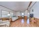 Living Room with light beige couch, recliner, and wood floors at 4853 Blanco Dr, Zephyrhills, FL 33541