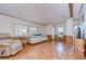 Living room with light beige couch and wood flooring at 4853 Blanco Dr, Zephyrhills, FL 33541