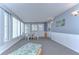 Sunroom features a table, chairs, and lounge chair at 4853 Blanco Dr, Zephyrhills, FL 33541