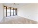 Bright bedroom with water view and sliding glass doors to balcony at 500 N Osceola Ave # 406, Clearwater, FL 33755