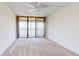 Bright bedroom with water view and sliding glass doors to balcony at 500 N Osceola Ave # 406, Clearwater, FL 33755