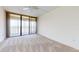 Bright bedroom with water view and sliding glass doors to balcony at 500 N Osceola Ave # 406, Clearwater, FL 33755