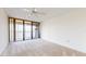 Bright bedroom with water view and sliding glass doors to balcony at 500 N Osceola Ave # 406, Clearwater, FL 33755