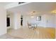 Bright dining room with glass table and kitchen access at 500 N Osceola Ave # 406, Clearwater, FL 33755