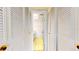 Hallway with built-in storage and access to bathroom at 500 N Osceola Ave # 406, Clearwater, FL 33755