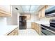 Bright kitchen with wood cabinets, stainless steel appliances, and white countertops at 500 N Osceola Ave # 406, Clearwater, FL 33755