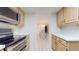 Kitchen with stainless steel appliances and view into dining area at 500 N Osceola Ave # 406, Clearwater, FL 33755