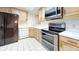 Kitchen with stainless steel appliances and light wood cabinets at 500 N Osceola Ave # 406, Clearwater, FL 33755