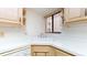 Kitchen corner sink with light wood cabinets and white countertops at 500 N Osceola Ave # 406, Clearwater, FL 33755