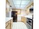Full view of kitchen with stainless steel appliances and wood cabinets at 500 N Osceola Ave # 406, Clearwater, FL 33755