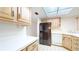Bright kitchen with wood cabinets, stainless steel appliances, and white countertops at 500 N Osceola Ave # 406, Clearwater, FL 33755