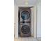 Stackable LG washer and dryer in a small laundry closet at 500 N Osceola Ave # 406, Clearwater, FL 33755