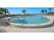 Inviting kidney-shaped pool with ample deck space at 500 N Osceola Ave # 406, Clearwater, FL 33755
