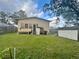 Spacious backyard with a shed and grassy lawn at 503 W Renfro St, Plant City, FL 33563