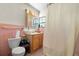 Bathroom with pink tile and a bathtub at 5693 11Th St S, St Petersburg, FL 33705