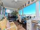 Bright home office features water views, built-in desk, and ample natural light at 6025 Shore S Blvd # 409, Gulfport, FL 33707