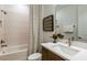 Clean bathroom with a single vanity, geometric tile shower, and updated fixtures at 6136 Jensen View Ave, Apollo Beach, FL 33572