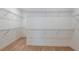 Large walk-in closet with wire shelving, providing ample storage space at 6136 Jensen View Ave, Apollo Beach, FL 33572