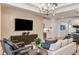 Comfortable living room with built in bar and neutral color palette at 6136 Jensen View Ave, Apollo Beach, FL 33572