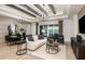 Living room with lake view and sliding glass doors at 6136 Jensen View Ave, Apollo Beach, FL 33572