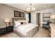 Spacious main bedroom with plush bedding and stylish decor at 6136 Jensen View Ave, Apollo Beach, FL 33572