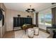 Stylish home office with built-in shelving and plenty of natural light at 6136 Jensen View Ave, Apollo Beach, FL 33572