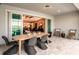 Covered patio with an outdoor dining area and kitchen views at 6136 Jensen View Ave, Apollo Beach, FL 33572