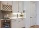 Stylish wet bar with wine rack and quartz countertop at 6136 Jensen View Ave, Apollo Beach, FL 33572