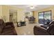 Open concept living space showcasing kitchen, dining and living areas at 7001 Jackson Springs Road, Tampa, FL 33634